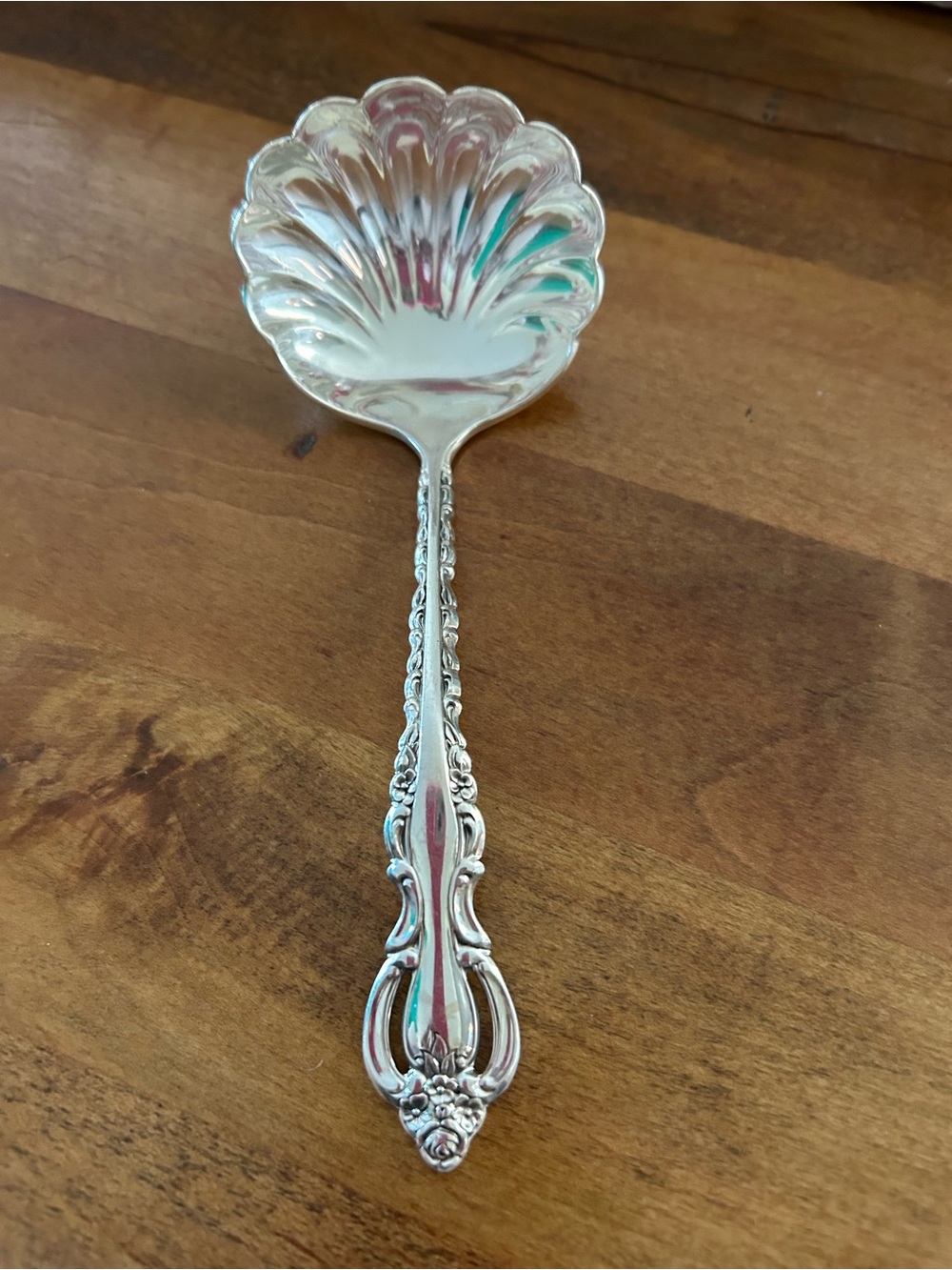 Ornate Silver Serving Spoon with Scalloped Shell Bowl
